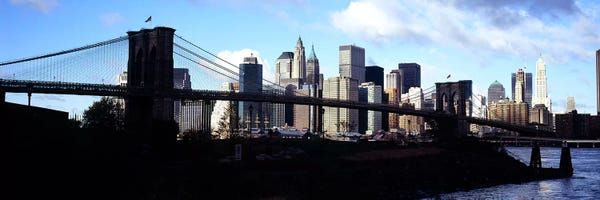 Brooklyn Bridge: Skyscrapers at the waterfront, Brooklyn Bridge, East River, Manhattan, New York City, New York State, USA by Panoramic Images