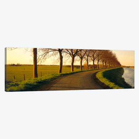 Tree-Lined Riverside Road, Noordbeemster, North Holland, Netherlands Canvas Print #PIM610} by Panoramic Images Canvas Print