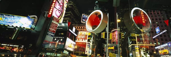 Times Square: Low angle view of buildings lit up at night, Times Square, Manhattan, New York City, New York State, USA by Panoramic Images