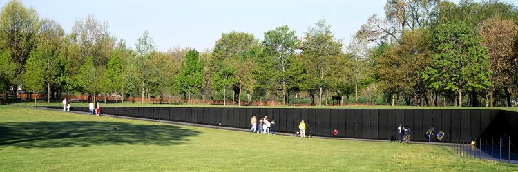 Tourists standing in front of a monumentVietnam Veterans Memorial, Washington DC, USA