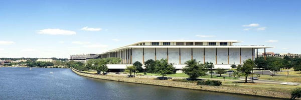 Washington, D.C.: Buildings along a riverPotomac River, John F. Kennedy Center for the Performing Arts, Washington DC, USA by Panoramic Images