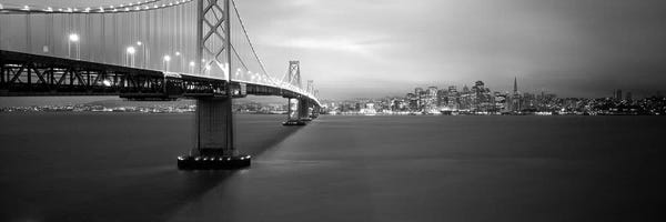 Large Black & White Art - Canvas Prints: Low angle view of a suspension bridge lit up at nightBay Bridge, San Francisco, California, USA by Panoramic Images