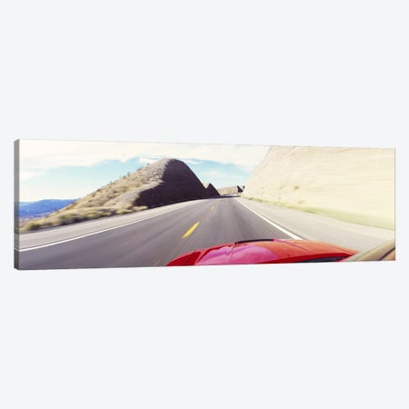 Car on a road, outside Las Vegas, Nevada, USA Canvas Print #PIM6307} by Panoramic Images Canvas Artwork