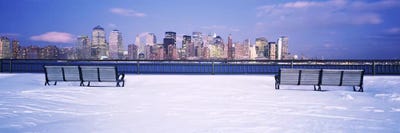 Park benches in snow with a city in the background, Lower Manhattan, Manhattan, New York City, New York State, USA by Panoramic Images multi panel art