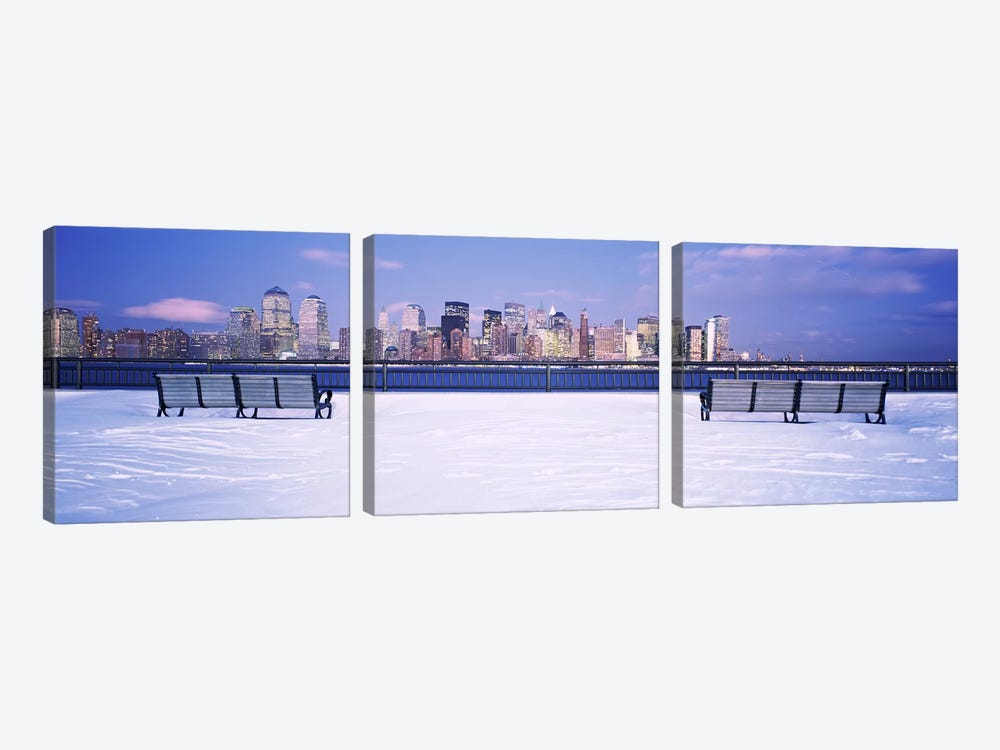 Park benches in snow with a city in the background, Lower Manhattan, Manhattan, New York City, New York State, USA by Panoramic Images 3-piece Canvas Artwork