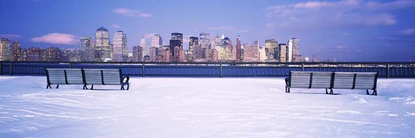 New York City Skylines: Park benches in snow with a city in the background, Lower Manhattan, Manhattan, New York City, New York State, USA by Panoramic Images
