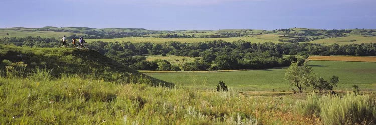 Three mountain bikers on a hill, Kansas, USA