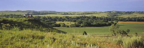 Three mountain bikers on a hill, Kansas, USA