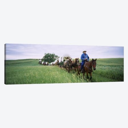 Historical reenactment of covered wagons in a field, North Dakota, USA Canvas Print #PIM6385} by Panoramic Images Canvas Wall Art