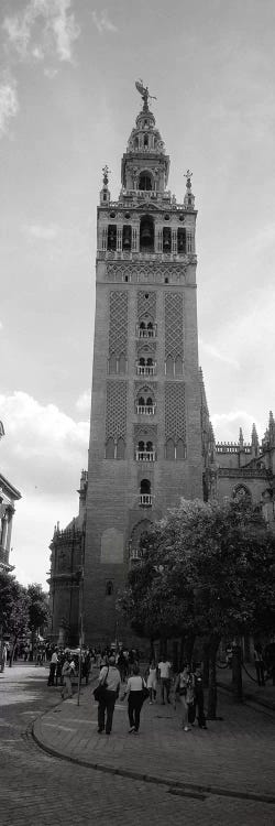 Group of people walking near a church, La Giralda, Seville Cathedral, Seville, Seville Province, Andalusia, Spain