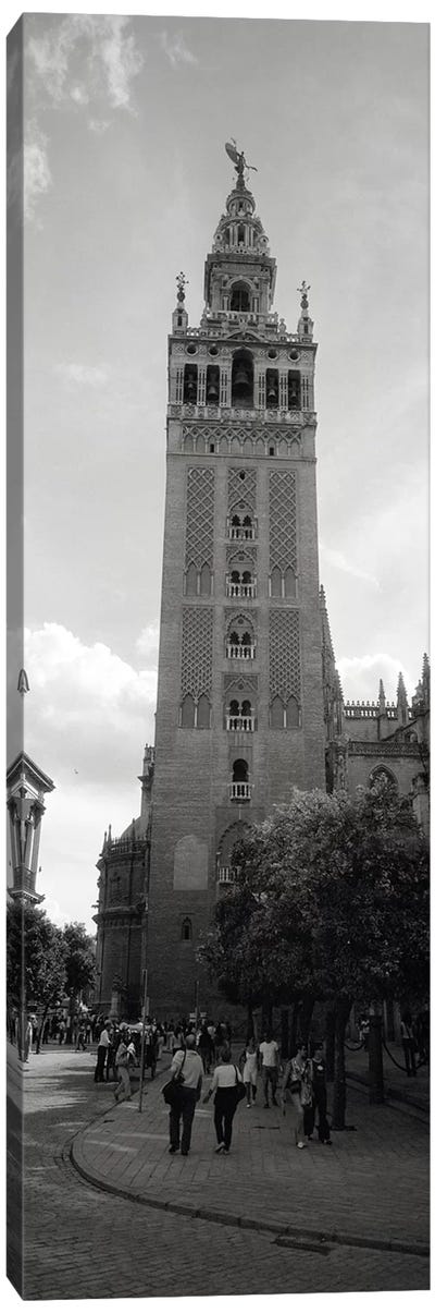 Group of people walking near a church, La Giralda, Seville Cathedral, Seville, Seville Province, Andalusia, Spain Canvas Art Print