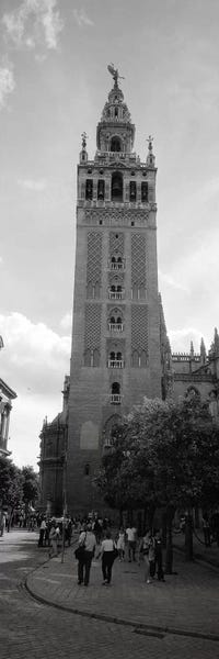 Group of people walking near a church, La Giralda, Seville Cathedral, Seville, Seville Province, Andalusia, Spain