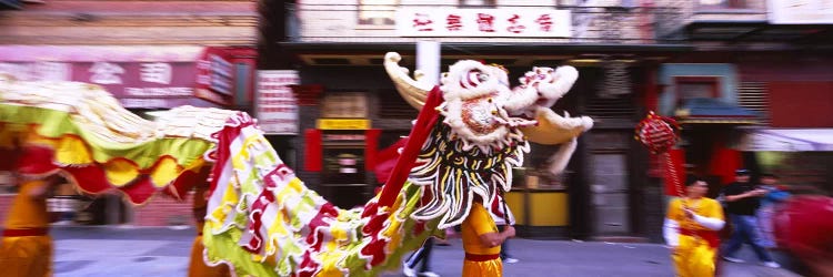 Group of people performing dragon dancing on a road, Chinatown, San Francisco, California, USA