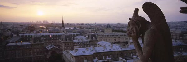 Notre Dame Cathedral: Chimera sculpture with a cityscape in the backgroundGalerie Des Chimeres, Notre Dame, Paris, Ile-De-France, France by Panoramic Images