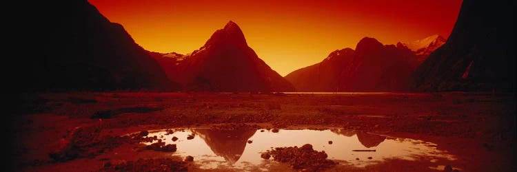 Orangish-Red Sunrise Over Mitre Peak And Milford Sound, South Island, New Zealand