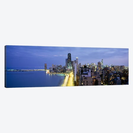 Skyscrapers lit up at the waterfront, Lake Shore Drive, Chicago, Cook County, Illinois, USA Canvas Print #PIM6549} by Panoramic Images Canvas Art Print