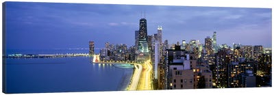 Skyscrapers lit up at the waterfront, Lake Shore Drive, Chicago, Cook County, Illinois, USA Canvas Art Print - Chicago Skylines