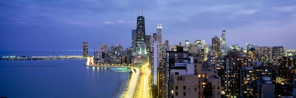 Chicago Skylines: Skyscrapers lit up at the waterfront, Lake Shore Drive, Chicago, Cook County, Illinois, USA by Panoramic Images