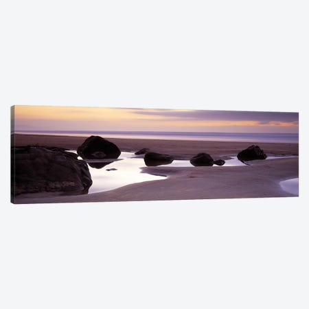 Rocks on the beachSandymouth Bay, Bude, Cornwall, England Canvas Print #PIM6589} by Panoramic Images Canvas Print