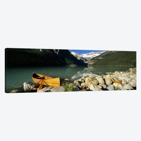 Lone Canoe, Lake Louise, Banff National Park, Alberta, Canada Canvas Print #PIM6616} by Panoramic Images Canvas Artwork
