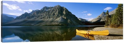Crowfoot Mountain With A Lone Canoe On The Shore Of Bow Lake, Banff National Park, Alberta, Canada Canvas Art Print