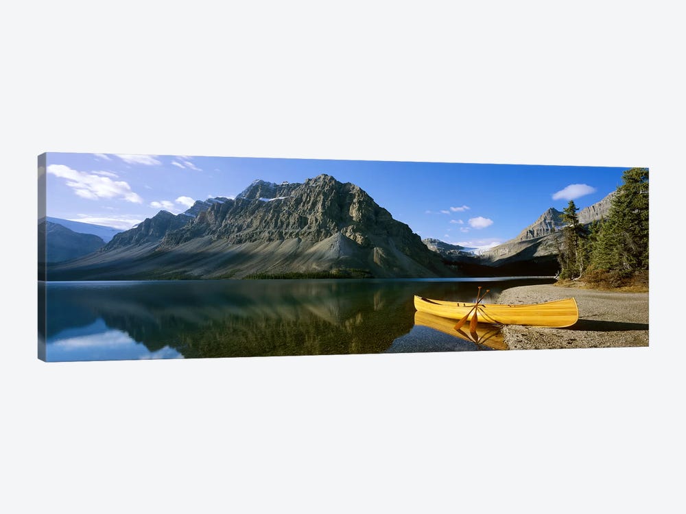 Crowfoot Mountain With A Lone Canoe On The Shore Of Bow Lake, Banff National Park, Alberta, Canada by Panoramic Images 1-piece Art Print