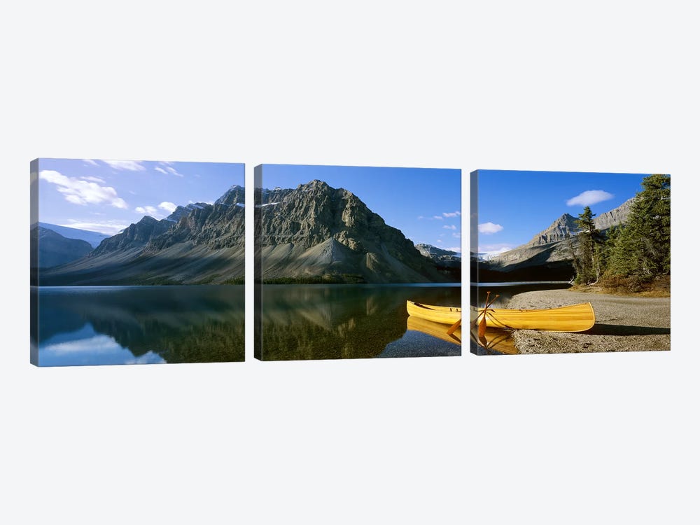 Crowfoot Mountain With A Lone Canoe On The Shore Of Bow Lake, Banff National Park, Alberta, Canada by Panoramic Images 3-piece Art Print