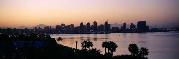 City Sunrises & Sunsets: Silhouette of buildings at the waterfront, San Diego, San Diego Bay, San Diego County, California, USA by Panoramic Images