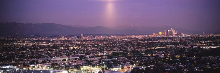 Buildings in a city lit up at dusk, Hollywood, San Gabriel Mountains, City Of Los Angeles, Los Angeles County, California, USA