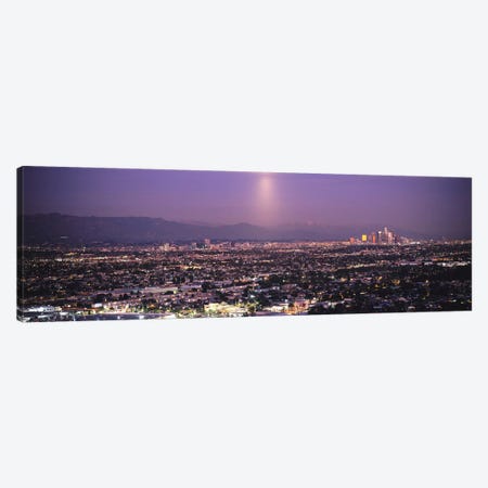Buildings in a city lit up at dusk, Hollywood, San Gabriel Mountains, City Of Los Angeles, Los Angeles County, California, USA Canvas Print #PIM6636} by Panoramic Images Canvas Wall Art