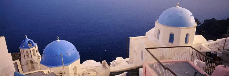 High angle view of blue domed church at the coast, Oia, Santorini, Greece