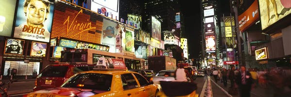 Times Square: Buildings lit up at night in a cityBroadway, Times Square, Midtown Manhattan, Manhattan, New York City, New York State, USA by Panoramic Images