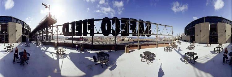 Tourist sitting on a roof outside a baseball stadium, Seattle, King County, Washington State, USA