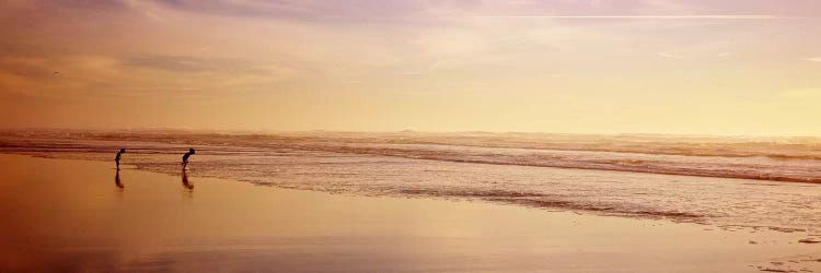 Two children playing on the beach, San Francisco, California, USA