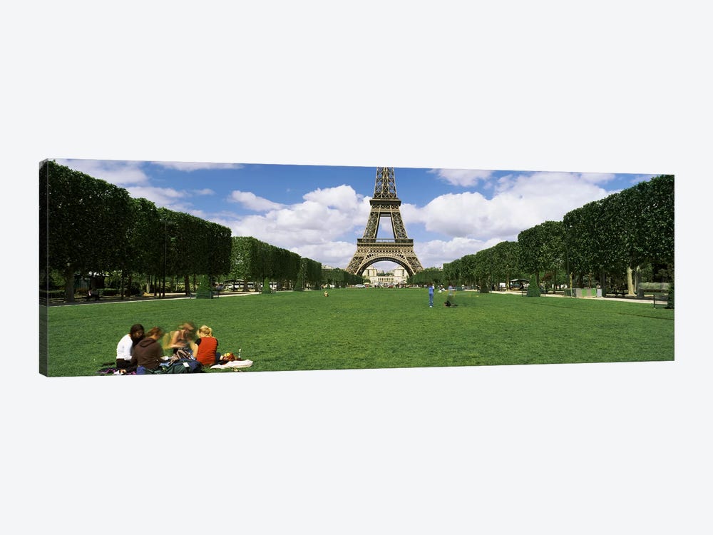 Tourists sitting in a park with a tower in the background, Eiffel Tower, Paris, Ile-de-France, France by Panoramic Images 1-piece Canvas Art