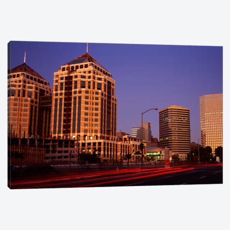 USA, California, Oakland, Alameda County, New City Center, Buildings lit up at night Canvas Print #PIM703} by Panoramic Images Art Print