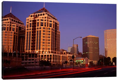 USA, California, Oakland, Alameda County, New City Center, Buildings lit up at night Canvas Art Print - Oakland