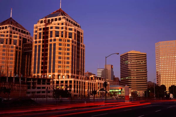 Oakland: USA, California, Oakland, Alameda County, New City Center, Buildings lit up at night by Panoramic Images