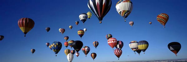 New Mexico: Hot air balloons floating in skyAlbuquerque International Balloon Fiesta, Albuquerque, Bernalillo County, New Mexico, USA by Panoramic Images
