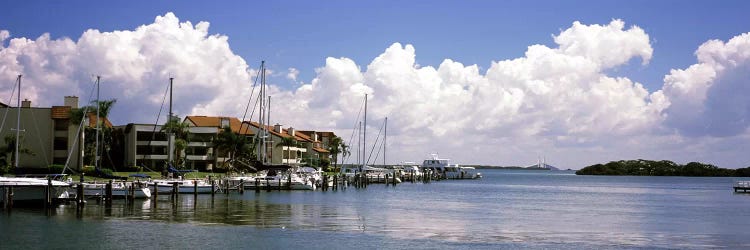 Boats docked in a bay, Cabbage Key, Sunshine Skyway Bridge in Distance, Tampa Bay, Florida, USA