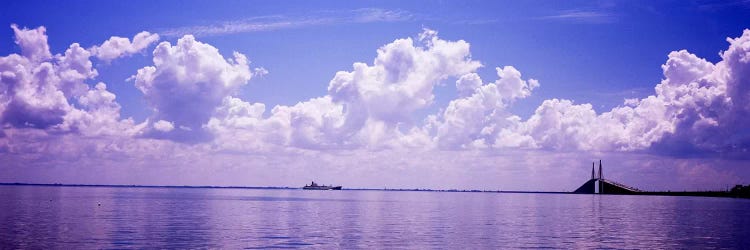 Sea with a container ship and a suspension bridge in distant, Sunshine Skyway Bridge, Tampa Bay, Gulf of Mexico, Florida, USA