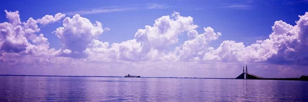Gulf Of Mexico: Sea with a container ship and a suspension bridge in distant, Sunshine Skyway Bridge, Tampa Bay, Gulf of Mexico, Florida, USA by Panoramic Images