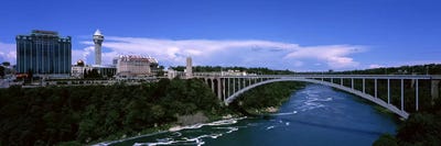 Bridge across a riverRainbow Bridge, Niagara River, Niagara Falls, New York State, USA by Panoramic Images canvas print
