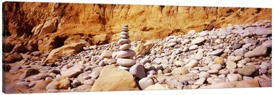 Stack of stones on the beach, California, USA Canvas Art Print - By Sentiment