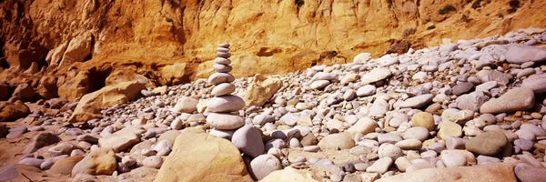 Stack of stones on the beach, California, USA