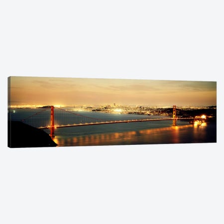 Suspension bridge lit up at dusk, Golden Gate Bridge, San Francisco Bay, San Francisco, California, USA Canvas Print #PIM7364} by Panoramic Images Art Print