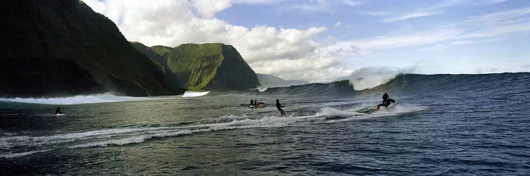 A Surfer Being Escorted To A Cresting Ocean Wave, Hawaii, USA