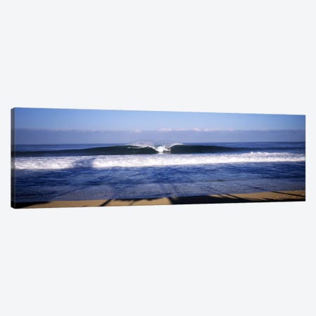 Distant View Of A Lone Surfer On A Cresting Wave, North Shore, Oahu, Hawaii, USA Canvas Print #PIM7423} by Panoramic Images Art Print