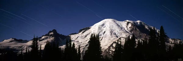 Snowy Mountains: Star trails over mountains, Mt Rainier, Washington State, USA by Panoramic Images