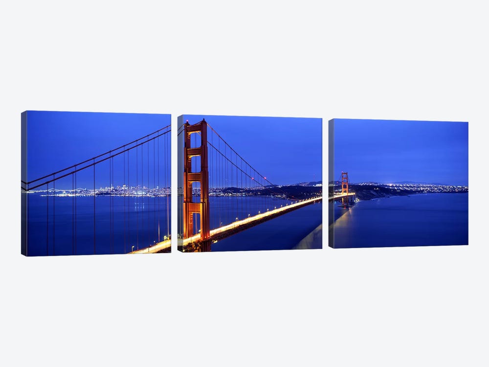 Suspension bridge lit up at duskGolden Gate Bridge, San Francisco, California, USA by Panoramic Images 3-piece Canvas Art
